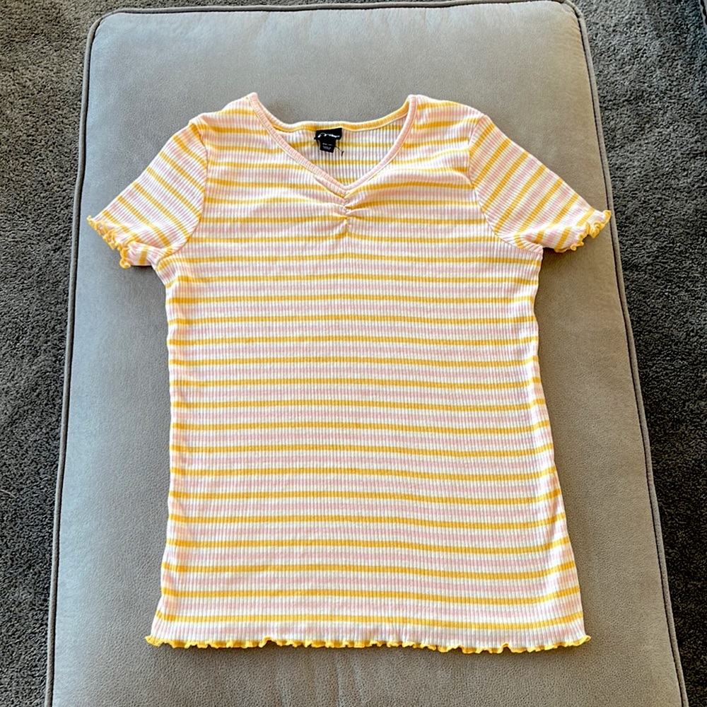 I’m selling a pink,yellow, and white top.The brand is art class and it is a xxl